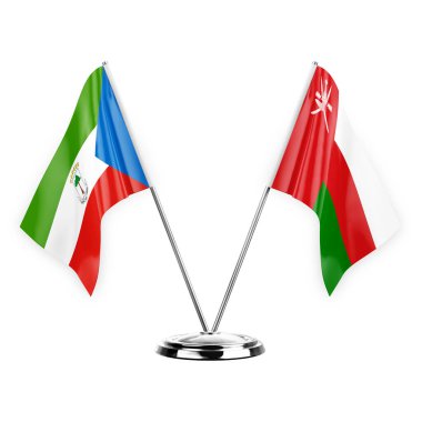 Two table flags isolated on white background 3d illustration, equatorial guinea and oman