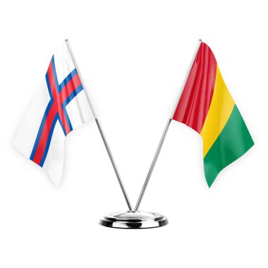 Two table flags isolated on white background 3d illustration, faroe islands and guinea