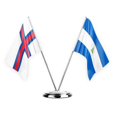 Two table flags isolated on white background 3d illustration, faroe islands and nicaragua
