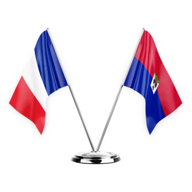 Two table flags isolated on white background 3d illustration, france and haiti