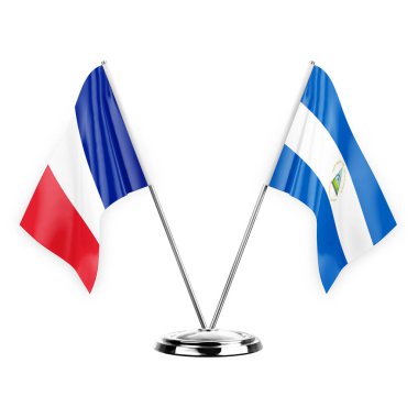 Two table flags isolated on white background 3d illustration, france and nicaragua