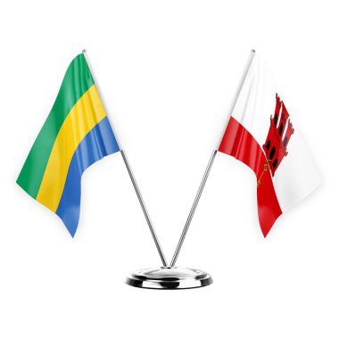 Two table flags isolated on white background 3d illustration, gabon and gibraltar