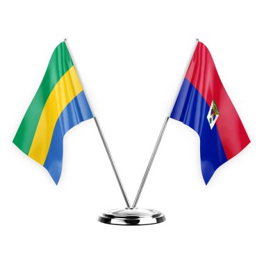 Two table flags isolated on white background 3d illustration, gabon and haiti