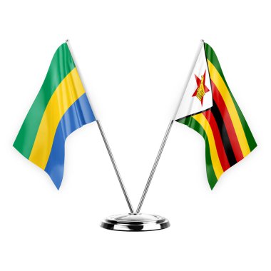 Two table flags isolated on white background 3d illustration, gabon and zimbabwe