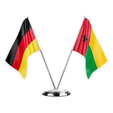 Two table flags isolated on white background 3d illustration, germany and guinea-bissau