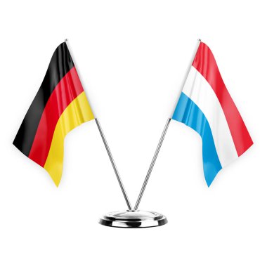 Two table flags isolated on white background 3d illustration, germany and luxembourg