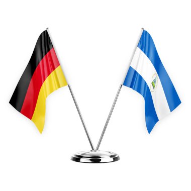 Two table flags isolated on white background 3d illustration, germany and nicaragua
