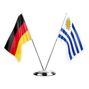 Two table flags isolated on white background 3d illustration, germany and uruguay