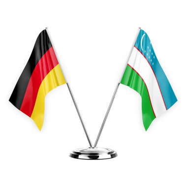Two table flags isolated on white background 3d illustration, germany and uzbekistan