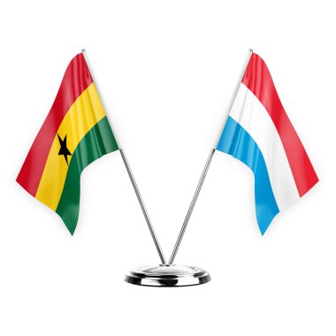 Two table flags isolated on white background 3d illustration, ghana and luxembourg