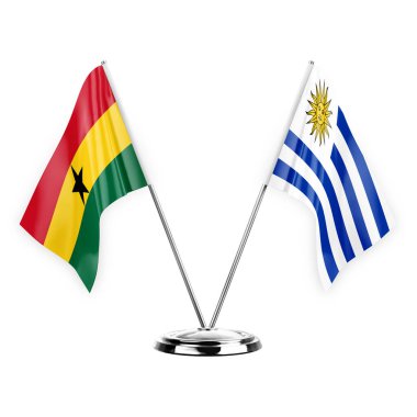 Two table flags isolated on white background 3d illustration, ghana and uruguay