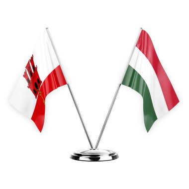 Two table flags isolated on white background 3d illustration, gibraltar and hungary