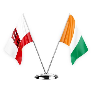 Two table flags isolated on white background 3d illustration, gibraltar and ivory coast
