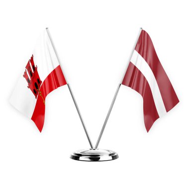 Two table flags isolated on white background 3d illustration, gibraltar and latvia