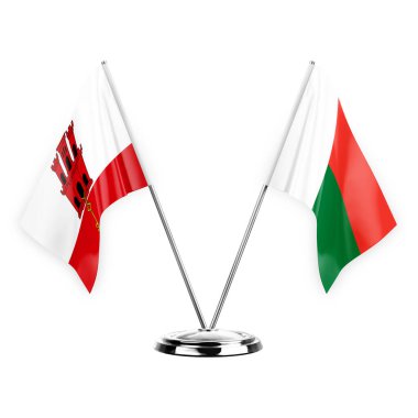 Two table flags isolated on white background 3d illustration, gibraltar and madagascar