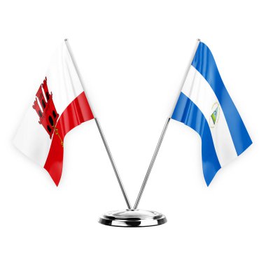 Two table flags isolated on white background 3d illustration, gibraltar and nicaragua