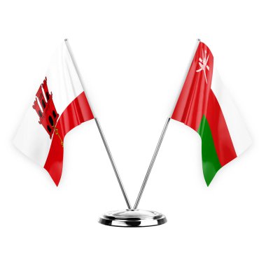 Two table flags isolated on white background 3d illustration, gibraltar and oman