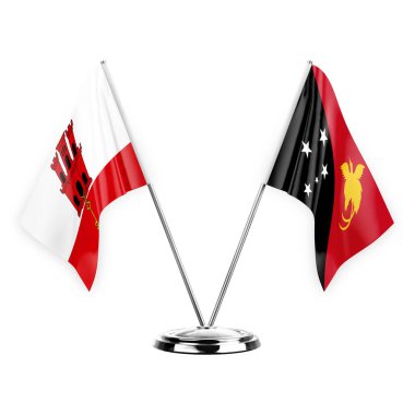 Two table flags isolated on white background 3d illustration, gibraltar and papua new guinea