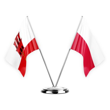 Two table flags isolated on white background 3d illustration, gibraltar and poland