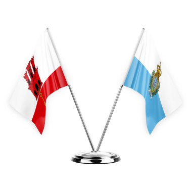 Two table flags isolated on white background 3d illustration, gibraltar and san marino