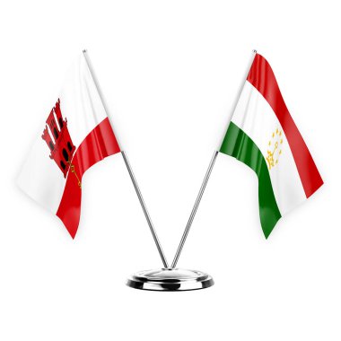 Two table flags isolated on white background 3d illustration, gibraltar and tajikistan