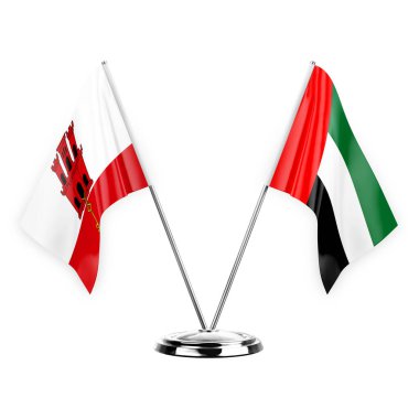 Two table flags isolated on white background 3d illustration, gibraltar and united arab emirates