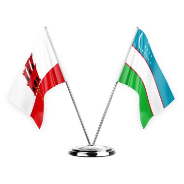 Two table flags isolated on white background 3d illustration, gibraltar and uzbekistan