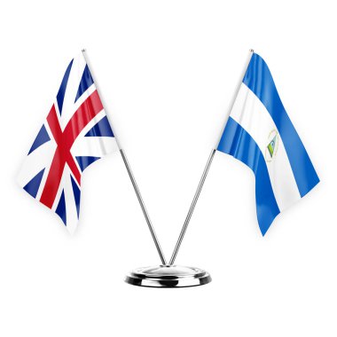 Two table flags isolated on white background 3d illustration, great britain and nicaragua