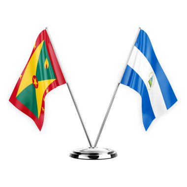 Two table flags isolated on white background 3d illustration, grenada and nicaragua