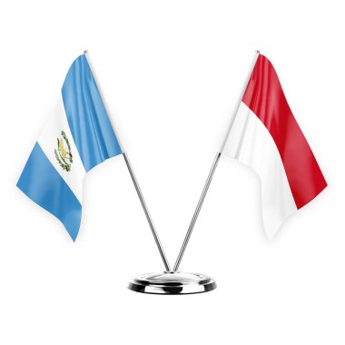 Two table flags isolated on white background 3d illustration, guatemala and monaco