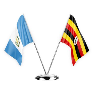 Two table flags isolated on white background 3d illustration, guatemala and uganda