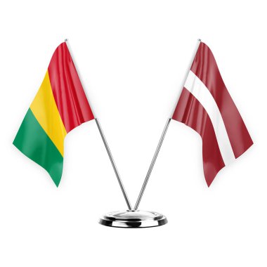 Two table flags isolated on white background 3d illustration, guinea and latvia