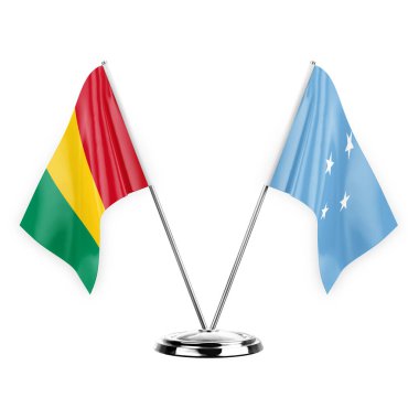 Two table flags isolated on white background 3d illustration, guinea and micronesia
