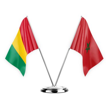 Two table flags isolated on white background 3d illustration, guinea and morocco