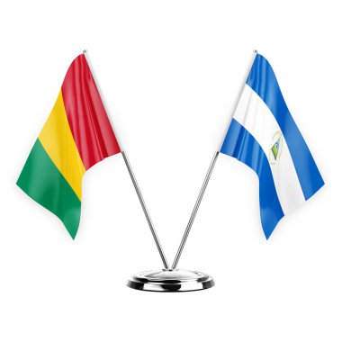 Two table flags isolated on white background 3d illustration, guinea and nicaragua