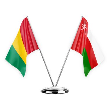 Two table flags isolated on white background 3d illustration, guinea and oman