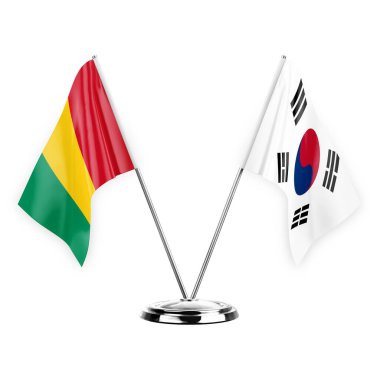 Two table flags isolated on white background 3d illustration, guinea and south korea