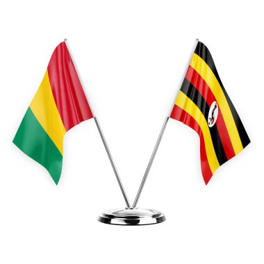 Two table flags isolated on white background 3d illustration, guinea and uganda
