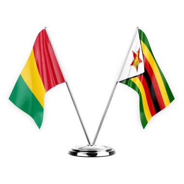 Two table flags isolated on white background 3d illustration, guinea and zimbabwe