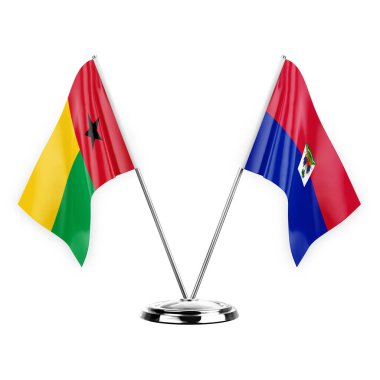 Two table flags isolated on white background 3d illustration, guinea-bissau and haiti