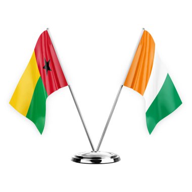 Two table flags isolated on white background 3d illustration, guinea-bissau and ivory coast