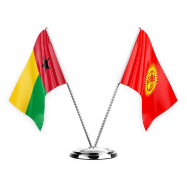 Two table flags isolated on white background 3d illustration, guinea-bissau and kyrgyzstan