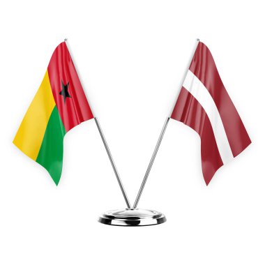 Two table flags isolated on white background 3d illustration, guinea-bissau and latvia