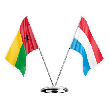 Two table flags isolated on white background 3d illustration, guinea-bissau and luxembourg