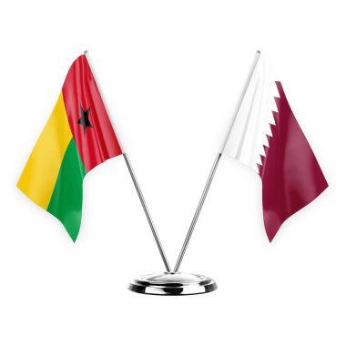 Two table flags isolated on white background 3d illustration, guinea-bissau and qatar