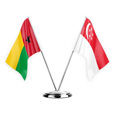 Two table flags isolated on white background 3d illustration, guinea-bissau and singapore