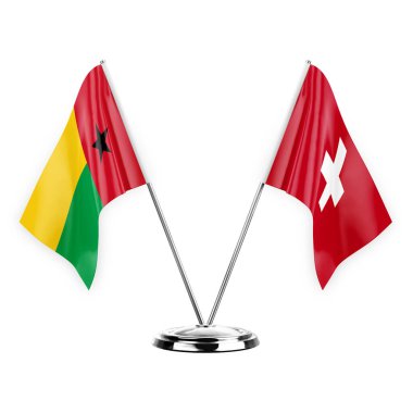 Two table flags isolated on white background 3d illustration, guinea-bissau and switzerland