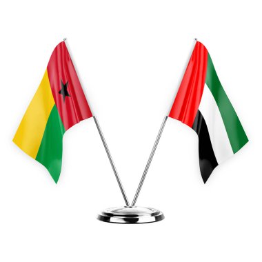 Two table flags isolated on white background 3d illustration, guinea-bissau and united arab emirates