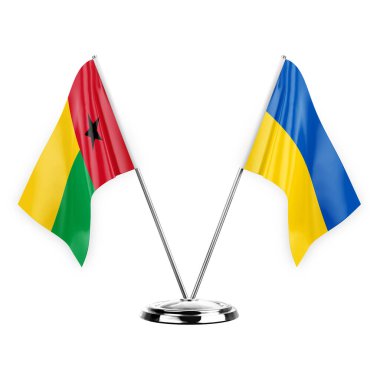 Two table flags isolated on white background 3d illustration, guinea-bissau and ukraine