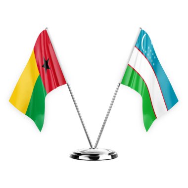 Two table flags isolated on white background 3d illustration, guinea-bissau and uzbekistan